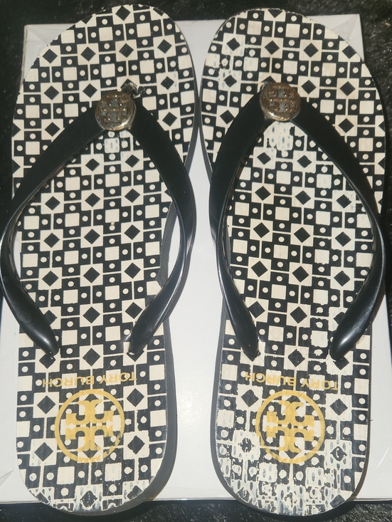 Tory Burch Shoes - Tory Burch Black and White Geometric Logo Flip Flops with Gold Medallion